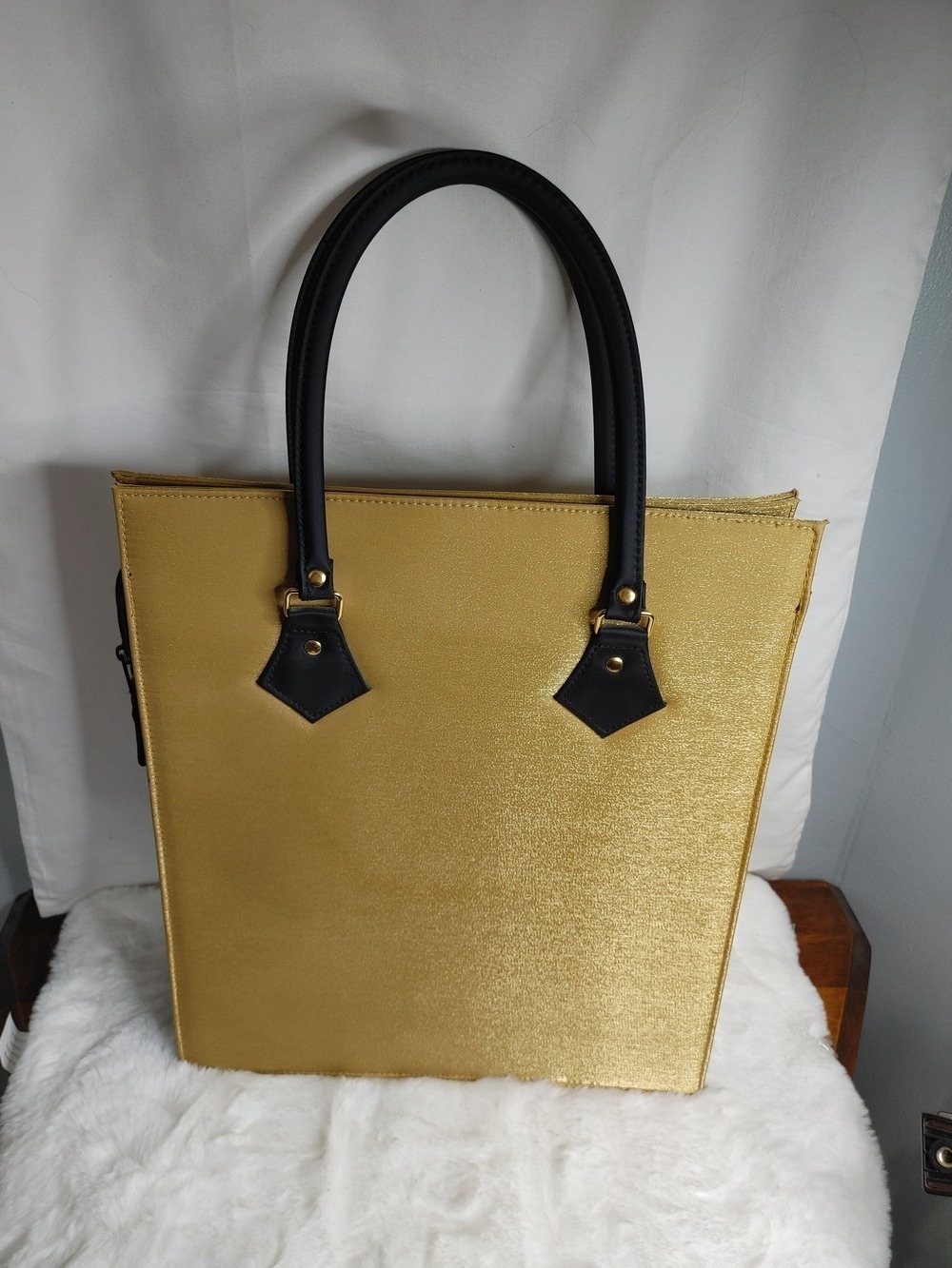 Elegant Roc Skincare Gold Tote with Black Handles
